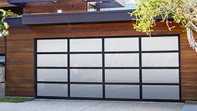 garage door with black anodized and white laminated aluminum.